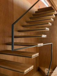 suspended stair with metal railing